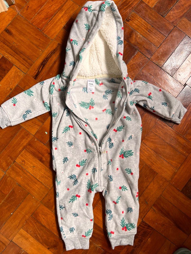 Carter's 6M Baby Onesie (Category: Babies & Kids Fashion) located in Paranaque City. Submitted by allabautstuff (Listing ID 1406143292, Image 1). Description: - Carter's onesie for 6-month-old babies. - Features a gray base with a festive leaf and berry pattern. - Includes a soft, white-lined hood. - Designed with a full-length zipper for easy dressing. - Made in Vietnam..