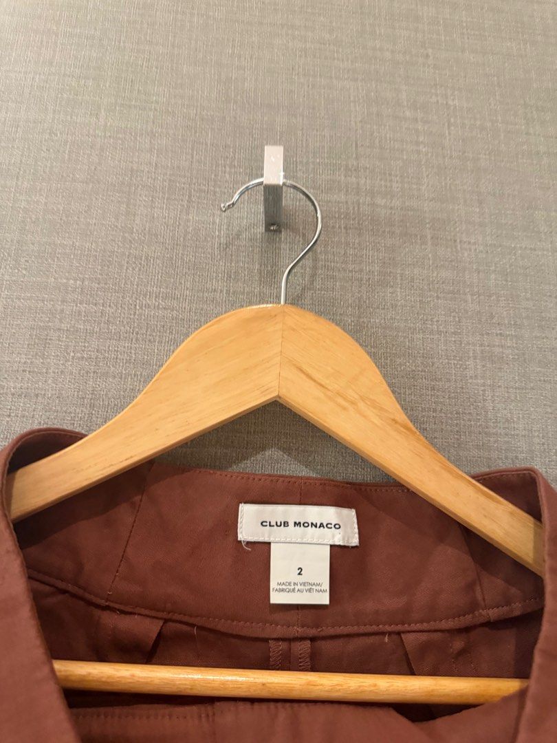 Club Monaco Brown Shorts Size 2 (Category: Shorts) located in Quezon City. Submitted by patpotpit (Listing ID 1406199367, Image 2). Description: Club Monaco brown shorts. Features a high-waisted design. Size 2. The shorts are a solid brown color. Made in Vietnam. The shorts are hanging on a wooden hanger..