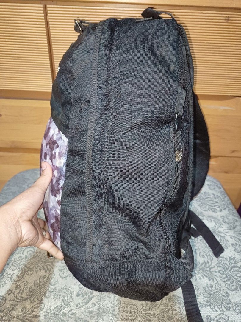 Herbalife Nutrition Backpack (Category: Backpacks) located in Baguio. Submitted by iyaberong48242 (Listing ID 1406215335, Image 3). Description: - Black backpack with Herbalife Nutrition logo - Front pocket with camouflage pattern - Adjustable shoulder straps - Multiple internal compartments - Top handle - Side zipper - Padded back support - Visible zippers.