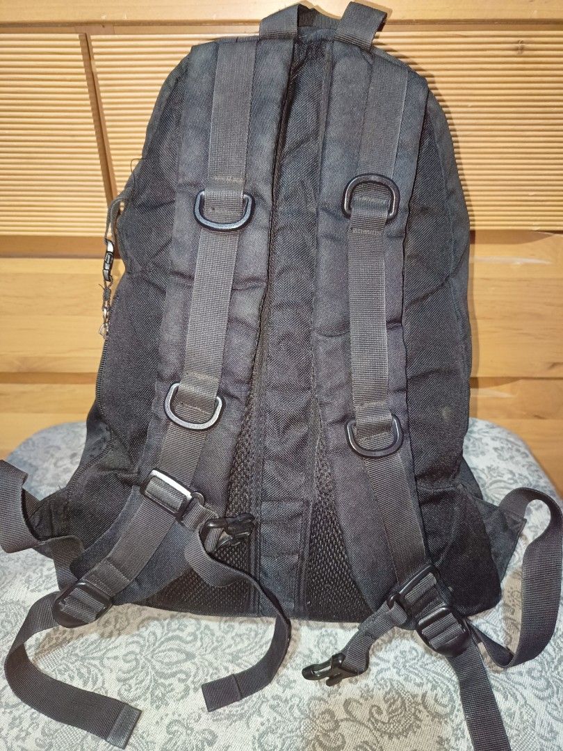 Herbalife Nutrition Backpack (Category: Backpacks) located in Baguio. Submitted by iyaberong48242 (Listing ID 1406215335, Image 2). Description: - Black backpack with Herbalife Nutrition logo - Front pocket with camouflage pattern - Adjustable shoulder straps - Multiple internal compartments - Top handle - Side zipper - Padded back support - Visible zippers.