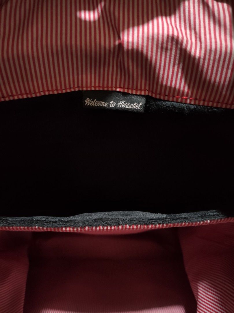 Herschel Floral Backpack (Category: Backpacks) located in Quezon City. Submitted by jhaneth21 (Listing ID 1406147177, Image 3). Description: - Herschel floral backpack - Adjustable straps - Drawstring closure - Front pocket - Padded back support - Red and white striped lining - Herschel label.
