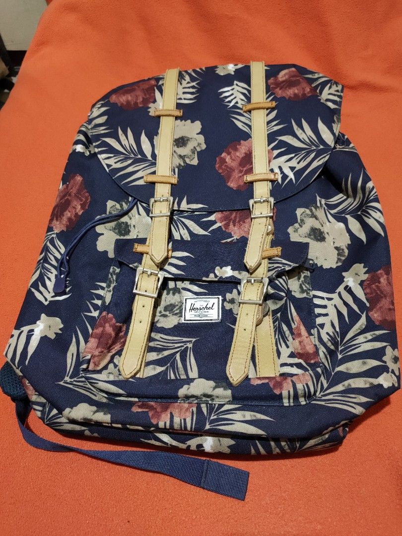 Herschel Floral Backpack (Category: Backpacks) located in Quezon City. Submitted by jhaneth21 (Listing ID 1406147177, Image 1). Description: - Herschel floral backpack - Adjustable straps - Drawstring closure - Front pocket - Padded back support - Red and white striped lining - Herschel label.