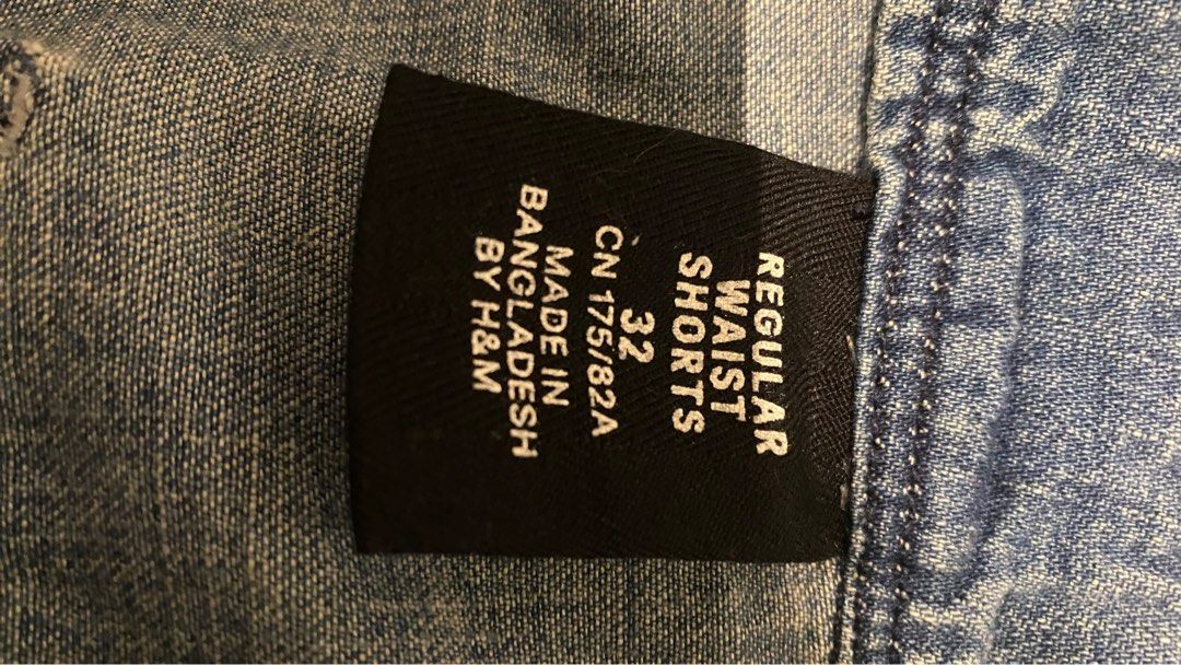 H&M Regular Waist Shorts - Size 32 (Category: Shorts) located in Mandaluyong City. Submitted by choloooo (Listing ID 1406197758, Image 2). Description: - H&M regular waist shorts - Size: 32 - Features a button and zipper closure - Distressed design with faded areas - Made in Bangladesh.