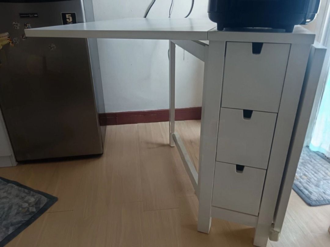 IKEA Norden Gateleg (White) Space Saver Table (Category: Tables & Sets) located in Manila. Submitted by carou48348 (Listing ID 1406151235, Image 3). Description: For Sale: IKEA Norden Gateleg Type: Multifunctional and Space Saver Table Original Price: Php 14,999.00 SELLING PRICE: Php 9,000.00 (negotiable) Status: Good as new with few dents and scratches RFS: Need Cash Nearby Landmarks: La Salle and Cash and Carry Note: For pick up (Friday and Sat