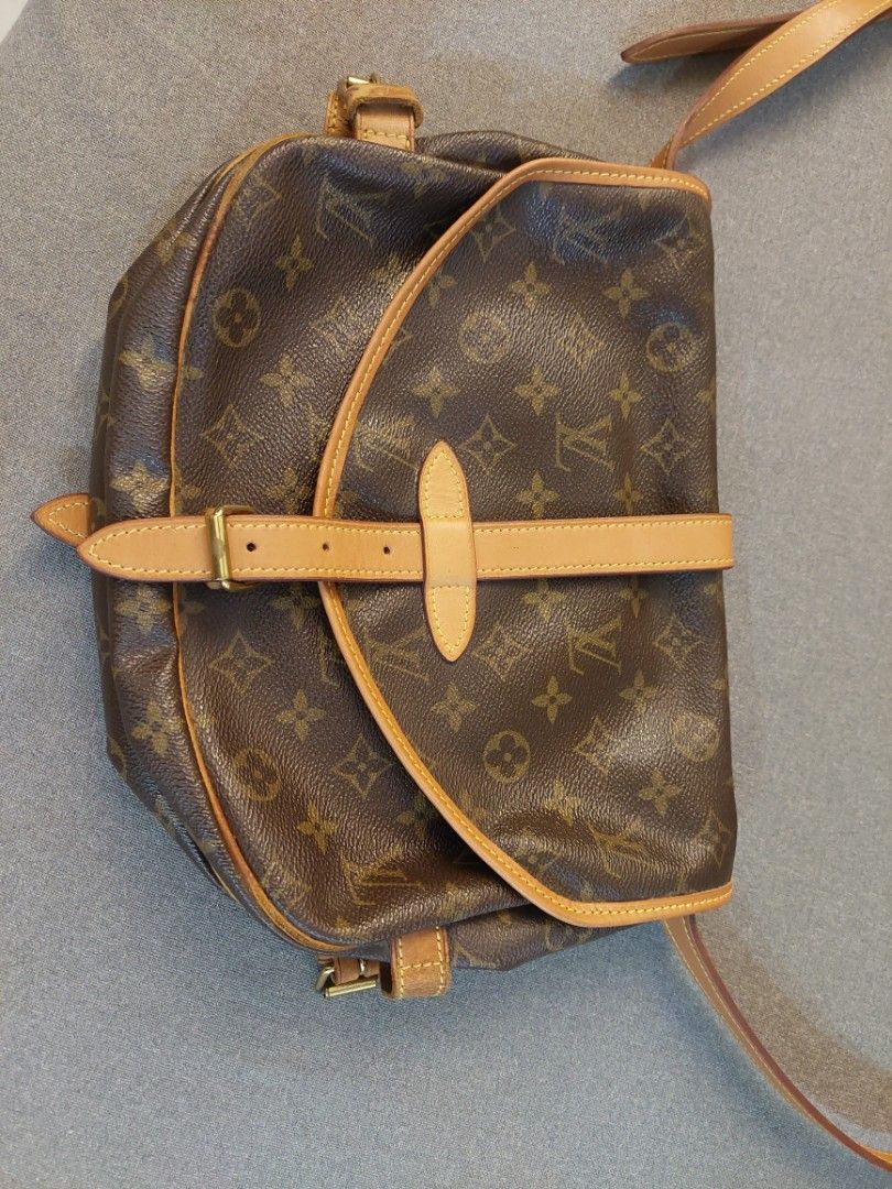 Louis Vuitton Saumur 30 (Category: Luxury Bags & Wallets) located in Rizal. Submitted by Bop9897 (Listing ID 1406207856, Image 2). Description: Guaranteed authentic Actual photos are posted Strap was replaced already Bought from Japan **** negotiable - Flap closure with leather strap and buckle - Tan leather trim and shoulder strap - Tan fabric interior lining - Made in France - Date code: MB0091.