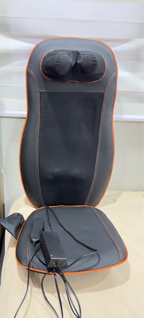 Massage Chair Pad with Heat (Category: Massage Devices) located in Lipa City. Submitted by kayetperry (Listing ID 1406186258, Image 1). Description: - Black massage chair pad with orange trim - Includes headrest and seat cushion - Features a breathable mesh center - Comes with a power adapter - Integrated control unit for easy operation.
