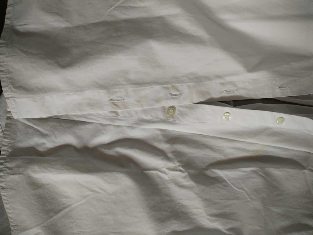 Mosaic White Long Sleeve Shirt (Category: Blouses) located in Pasig City. Submitted by jacq0301 (Listing ID 1406127779, Image 2). Description: - Mosaic white long sleeve shirt - Classic collar and button-down front - Longer length - Pleated back detail - Visible stains on front and collar - Roll-up sleeves - Lightweight fabric.