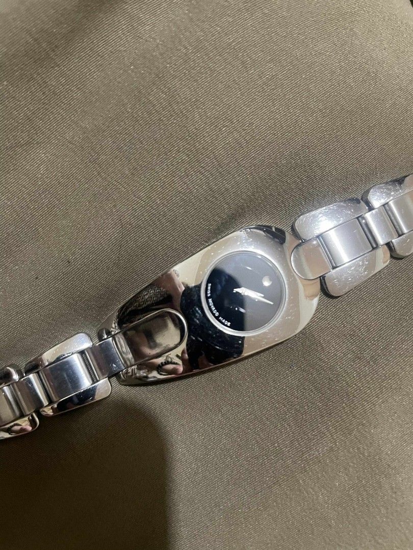 Movado Watch (Category: Luxury Watches) located in Santa Rosa. Submitted by mariekarol23638 (Listing ID 1406154637, Image 1). Description: - Movado watch - Silver stainless steel band - Black watch face with unique design .