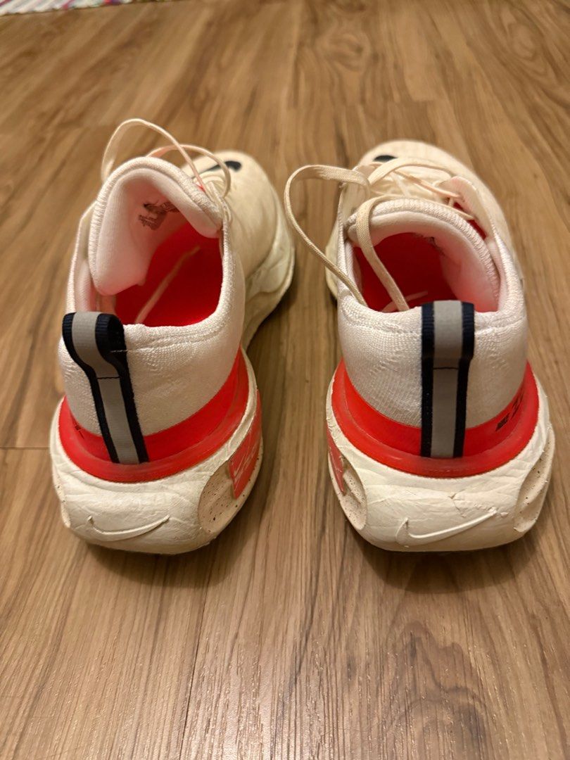 Nike ZoomX Invincible Run 3 Flyknit - Size 10 (Category: Sneakers) located in Taguig. Submitted by regpaj (Listing ID 1406247649, Image 2). Description: - Nike ZoomX Invincible Run Flyknit - Color: Cream and Red - Size: US 10 - Features: - Black Nike swoosh logo - ZoomX midsole - Flyknit upper - Condition: Some wear on soles - Includes original laces.