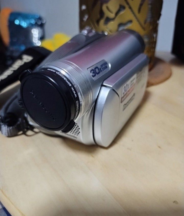 Panasonic PV-GS36 Camcorder with Accessories (Category: Video Cameras) located in Las Pinas. Submitted by indigo_blue88 (Listing ID 1406156684, Image 2). Description: - Panasonic PV-GS36 camcorder - 30x optical zoom - Includes: bag, extra strap, battery charger, and small tripod - Extra genuine Panasonic CGAA-DU12 battery included - Features one-touch navigation and joystick control - SD card NOT included - For Metro Manila buyers only.