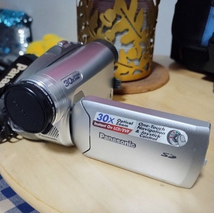 Panasonic PV-GS36 Camcorder with Accessories (Category: Video Cameras) located in Las Pinas. Submitted by indigo_blue88 (Listing ID 1406156684, Image 3). Description: - Panasonic PV-GS36 camcorder - 30x optical zoom - Includes: bag, extra strap, battery charger, and small tripod - Extra genuine Panasonic CGAA-DU12 battery included - Features one-touch navigation and joystick control - SD card NOT included - For Metro Manila buyers only.
