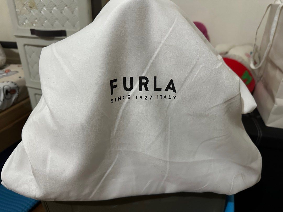 Preloved Furla Tote Bag (Category: Luxury Bags & Wallets) located in Quezon City. Submitted by jiinalin (Listing ID 1406249015, Image 3). Description: Like new. It fits 13-inch macbook/laptop. Pebbled leather With dust bag RFS - decluttering.