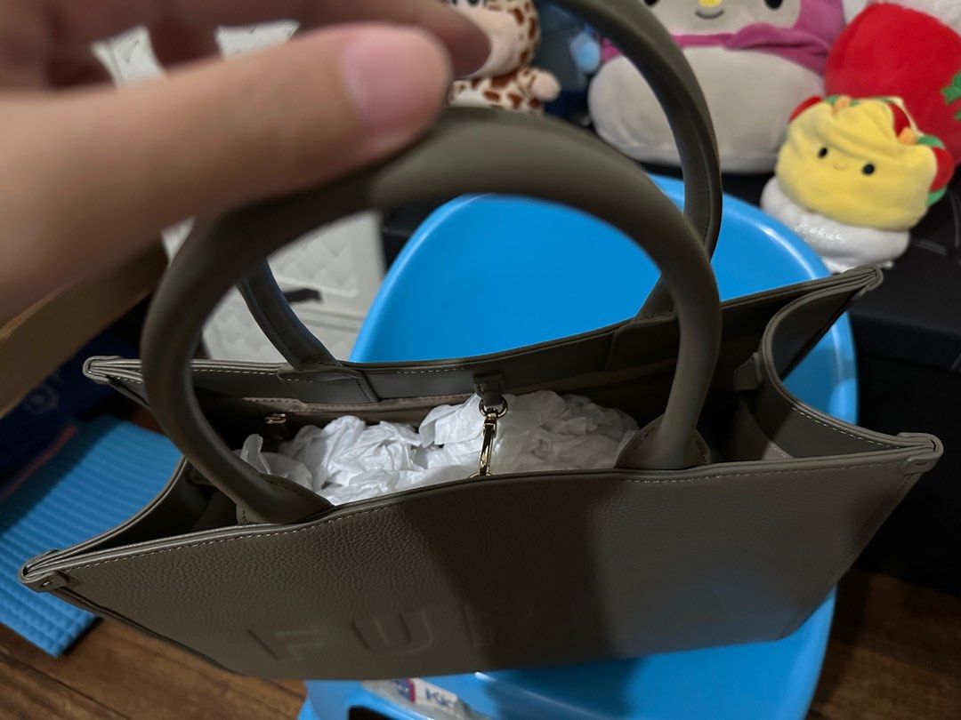Preloved Furla Tote Bag (Category: Luxury Bags & Wallets) located in Quezon City. Submitted by jiinalin (Listing ID 1406249015, Image 2). Description: Like new. It fits 13-inch macbook/laptop. Pebbled leather With dust bag RFS - decluttering.