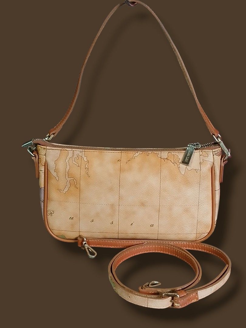 Prima Classe Map Kilibag Sling Bag (Category: Cross-body Bags) located in Zamboanga. Submitted by corneliasbags (Listing ID 1406165190, Image 3). Description: -malinis interior and body -no rubs, hard leather durable supertibay na material -comes with short and long strap -brass hardware, though good condition pero may hairlines specially ang puller ng zip. pacheck nlang sa pic..
