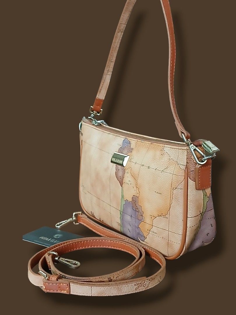 Prima Classe Map Kilibag Sling Bag (Category: Cross-body Bags) located in Zamboanga. Submitted by corneliasbags (Listing ID 1406165190, Image 2). Description: -malinis interior and body -no rubs, hard leather durable supertibay na material -comes with short and long strap -brass hardware, though good condition pero may hairlines specially ang puller ng zip. pacheck nlang sa pic..