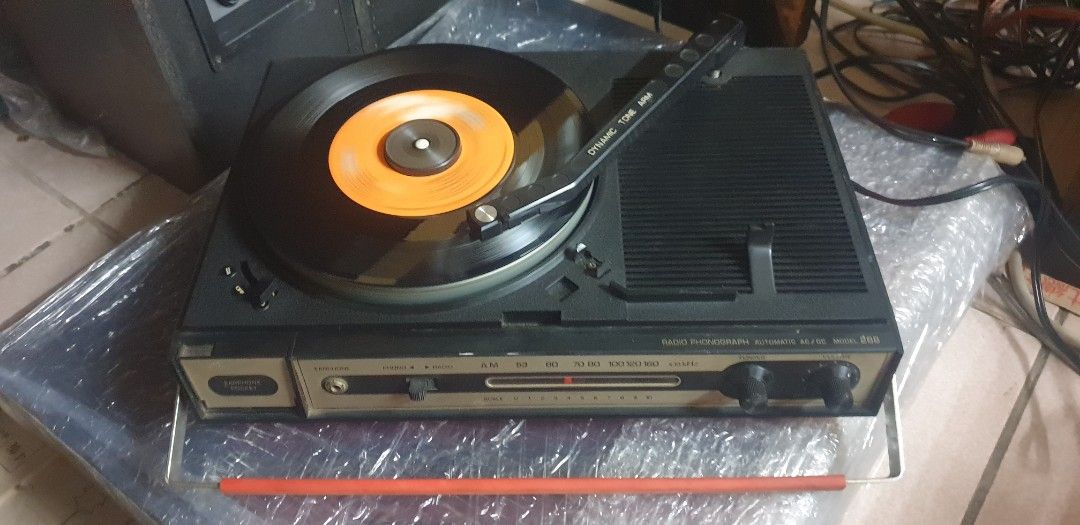 Red Columbia Radio Phono Player (Category: Portable Music Players) located in Manila. Submitted by zandre615 (Listing ID 1406178716, Image 3). Description: Vintage columbia radio & phono player plays both 33 & 45 vinyl Working am radio, phono player working 100V ac, no transformer included Issue: missing back cover Manila area.