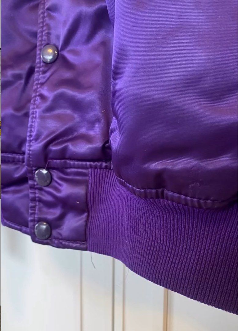 Starter NBA Los Angeles Lakers Jacket (Category: Coats, Jackets and Outerwear) located in Muntinlupa City. Submitted by sunsandandwaves (Listing ID 1406284274, Image 2). Description: NEGOTIABLE for sure buyer - Vintage Los Angeles Lakers jacket by Starter - Purple satin exterior - Yellow and white accents - Lakers logo on chest - NBA official licensed product - Quilted yellow lining - Purple ribbed collar, cuffs, and hem - Snap closures.