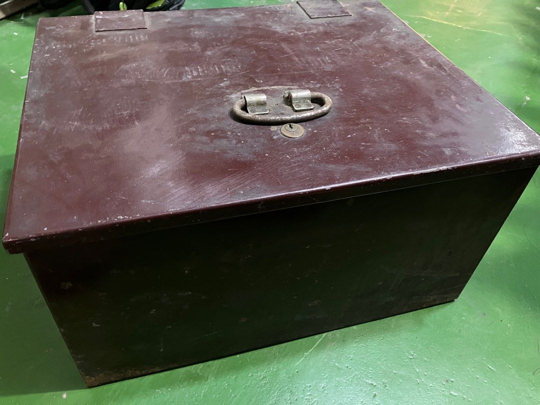 Vintage Metal Safe Box without key (Category: Safe) located in Angeles City. Submitted by jnwsurplus (Listing ID 1406237812, Image 2). Description: - Vintage metal safe box - Secure lock with key - Features a handle for easy carrying - Rectangular shape with hinged lid - Dark brown exterior - Made of metal.