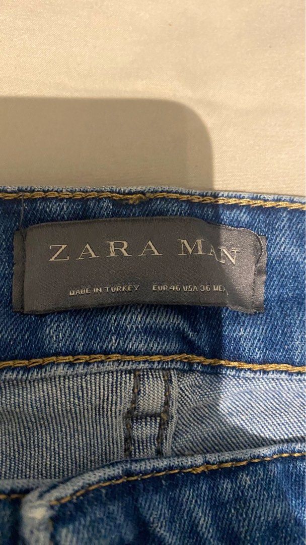 Zara Man Distressed Jeans (Category: Jeans) located in Mandaluyong City. Submitted by choloooo (Listing ID 1406197087, Image 2). Description: - Zara Man jeans - Distressed details - Classic five-pocket design - Straight leg fit - Medium blue wash - Frayed hem - Size: EUR 46 / USA 36 - Made in Turkey.