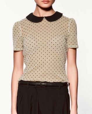 Zara Polka Dot Blouse with Peter Pan Collar (Category: Blouses) located in Rodriguez. Submitted by alekshivers (Listing ID 1400946801, Image 3). Description: - Zara polka dot blouse - Features a contrasting black Peter Pan collar and see through - Short sleeves - Lightweight fabric - Size XS - Made in Spain - Versatile for various outfits.