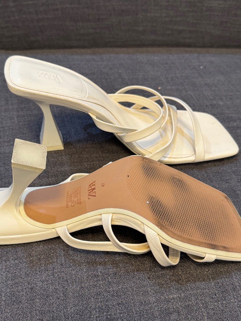 Zara Strappy Heeled Sandals - Size 41 (Category: Heels) located in Caloocan City. Submitted by basementbargain (Listing ID 1406100921, Image 3). Description: - Zara heeled sandals - Cream color - Size 41 - Square toe design - Unique heel shape - Soles show wear.