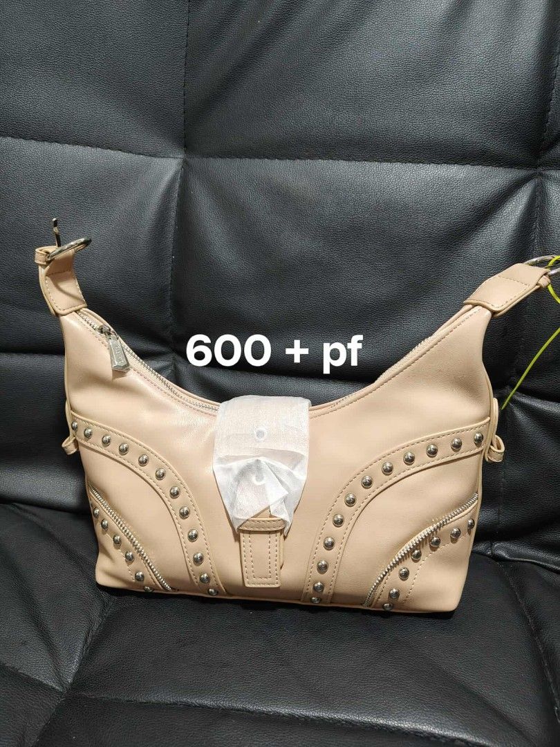 Alberto Bags Shoes (Category: Luxury Bags & Wallets) located in Manila. Submitted by tadeoea20213649 (Listing ID 1406420320, Image 1). Description: Stylish beige handbag with studded details. Features a zipper closure and a buckle accent. The bag has a shoulder strap. Perfect for everyday use. Price is 600 + pf..