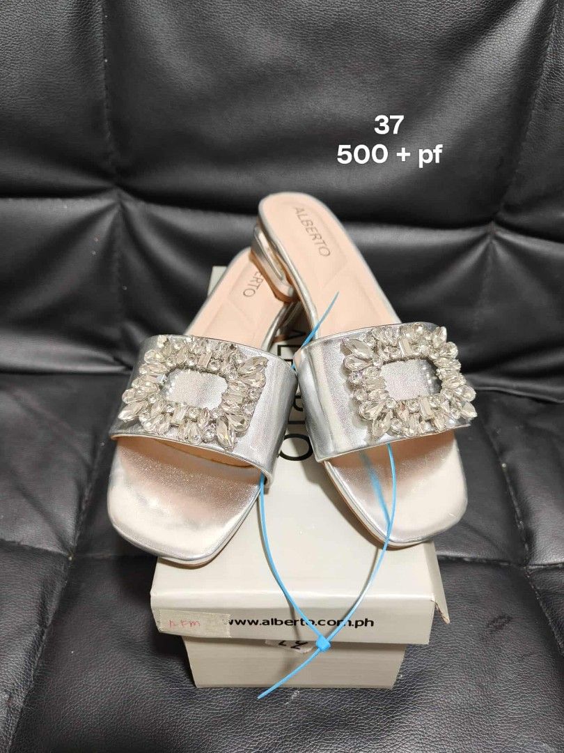 Alberto Bags Shoes (Category: Luxury Bags & Wallets) located in Manila. Submitted by tadeoea20213649 (Listing ID 1406420320, Image 2). Description: Stylish beige handbag with studded details. Features a zipper closure and a buckle accent. The bag has a shoulder strap. Perfect for everyday use. Price is 600 + pf..