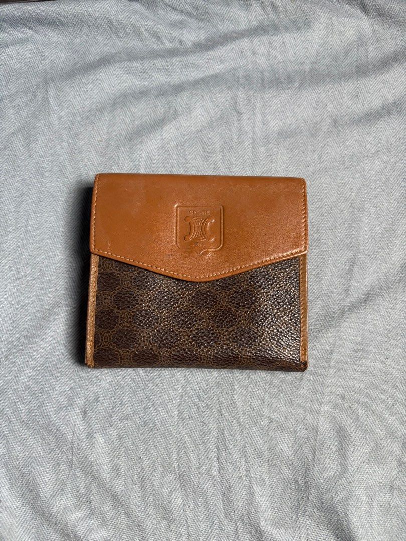 Aunthentic Celine Tri-Fold Wallet (Category: Luxury Bags & Wallets) located in Manila. Submitted by tatisdeclutters (Listing ID 1406303976, Image 2). Description: - Authentic Celine tri-fold wallet - Features the iconic Celine logo - Multiple card slots and coin compartment - Brown leather exterior with Celine print - Brown leather interior - Compact size, ideal for everyday use.