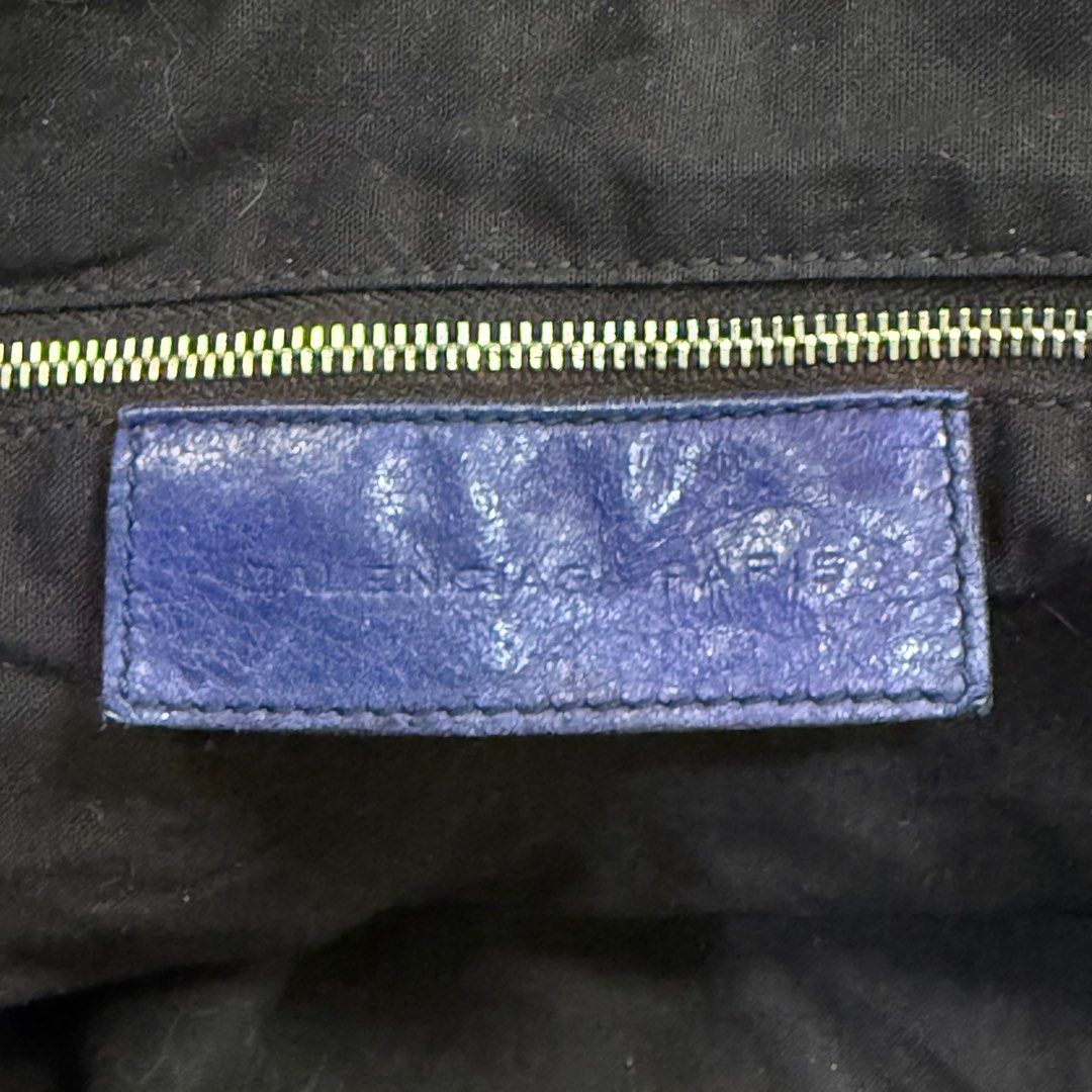 Balenciaga Leather Shoulder Bag (Category: Luxury Bags & Wallets) located in Kabacan. Submitted by rags2penny.phl (Listing ID 1406303739, Image 3). Description: -Authentic Balenciaga shoulder bag in a distressed leather finish. -Features multiple zippered compartments and a long adjustable strap. -The interior includes a leather tag with the brand name and "Made in Italy" printed. -The bag has a unique, textured appearance with silver-tone hardwa