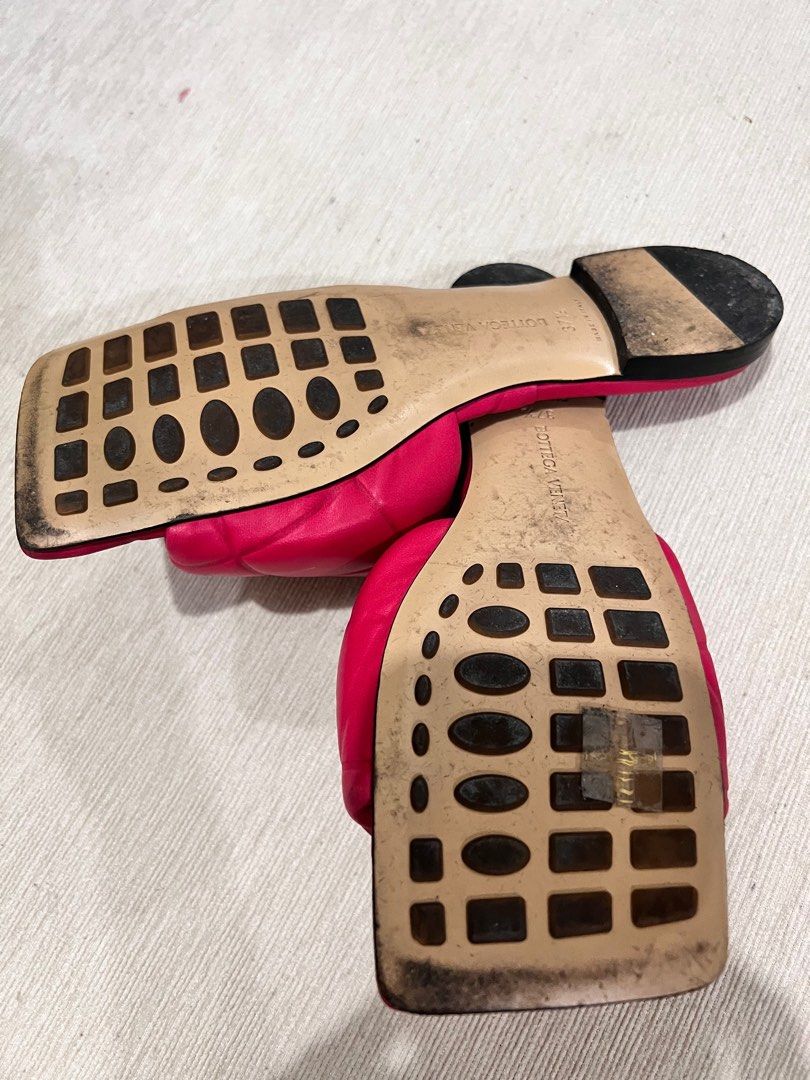 Bottega Veneta Quilted Sandals (Category: Flats & Sandals) located in Bulacan. Submitted by sssss45 (Listing ID 1406388201, Image 2). Description: - Authentic Bottega Veneta sandals - Vibrant red color - Quilted design - Slip-on style - Made in Italy - Shows some wear on soles - Stylish and comfortable.