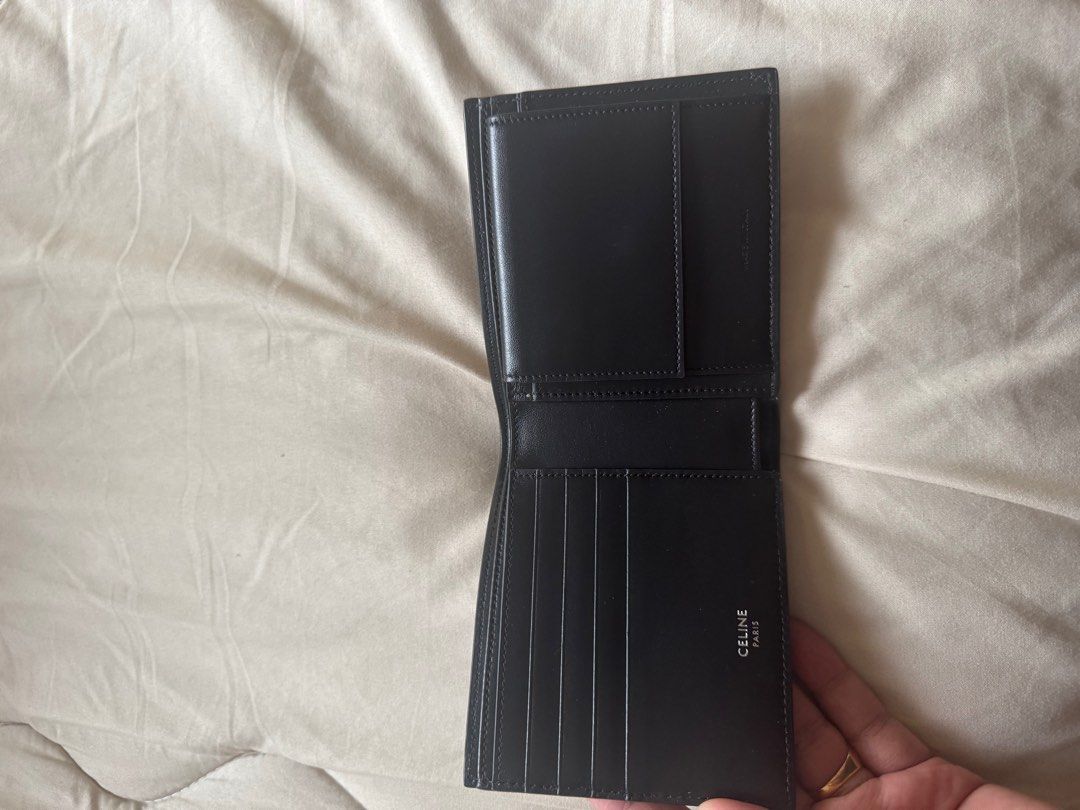 Celine Logo Bifold Wallet (Category: Luxury Bags & Wallets) located in Makati City. Submitted by titaninangfinds (Listing ID 1406317356, Image 3). Description: - Authentic Celine bifold wallet - Features the Celine logo in white - Multiple card slots and bill compartment - Crafted from leather - Compact and ideal for everyday use.