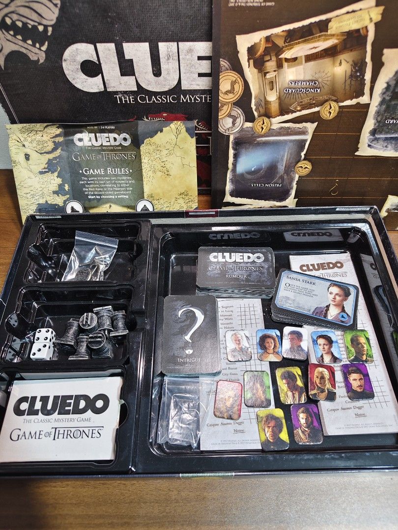 Cluedo Game of Thrones Board Game (Category: Board Games & Puzzles) located in Las Pinas. Submitted by mommy_14 (Listing ID 1406372826, Image 2). Description: - Game of Thrones Cluedo board game. - Features locations and characters from the TV series. - Includes game board, character cards, weapon tokens, and other game components. - For 2-6 players. - Complete set with box and all game pieces..