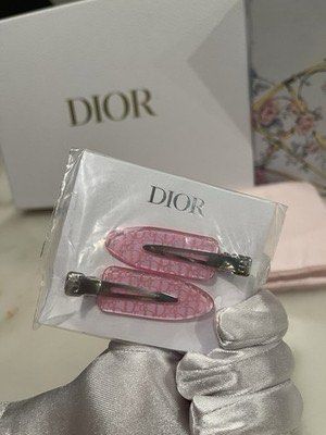 Dior Hair Clips (Category: Hair Accessories) located in Imus. Submitted by diana2999 (Listing ID 1406421576, Image 2). Description: - Authentic Dior hair clips - Pink transparent design - Features the Dior logo - Includes two hair clips - Comes with original packaging.