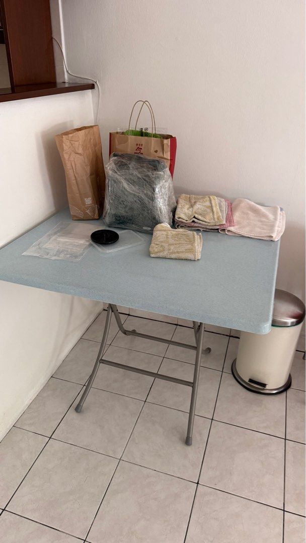 Foldable Table (Category: Tables & Sets) located in Klang. Submitted by simonchai75 (Listing ID 1406286852, Image 1). Description: - Foldable table for versatile use. - Light blue surface. - Durable metal frame. - Compact design for easy storage. - Ideal for indoor and outdoor activities. - Sturdy and reliable..