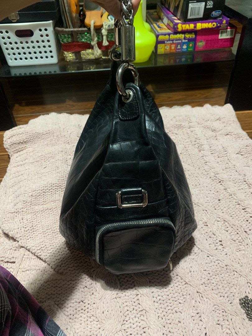 Furla Black Croc-Embossed Shoulder Bag (Category: Luxury Bags & Wallets) located in Bulacan. Submitted by love2loved (Listing ID 1406407976, Image 3). Description: - Furla shoulder bag - Black croc-embossed leather - Silver chain strap - Zipper closure - Interior side pocket - Furla branded tag - "Made in Cambodia" tag - Leather material Good condition medium size silver hardwarw YKK zipper with free silver chain furla chain maganda ung leather y