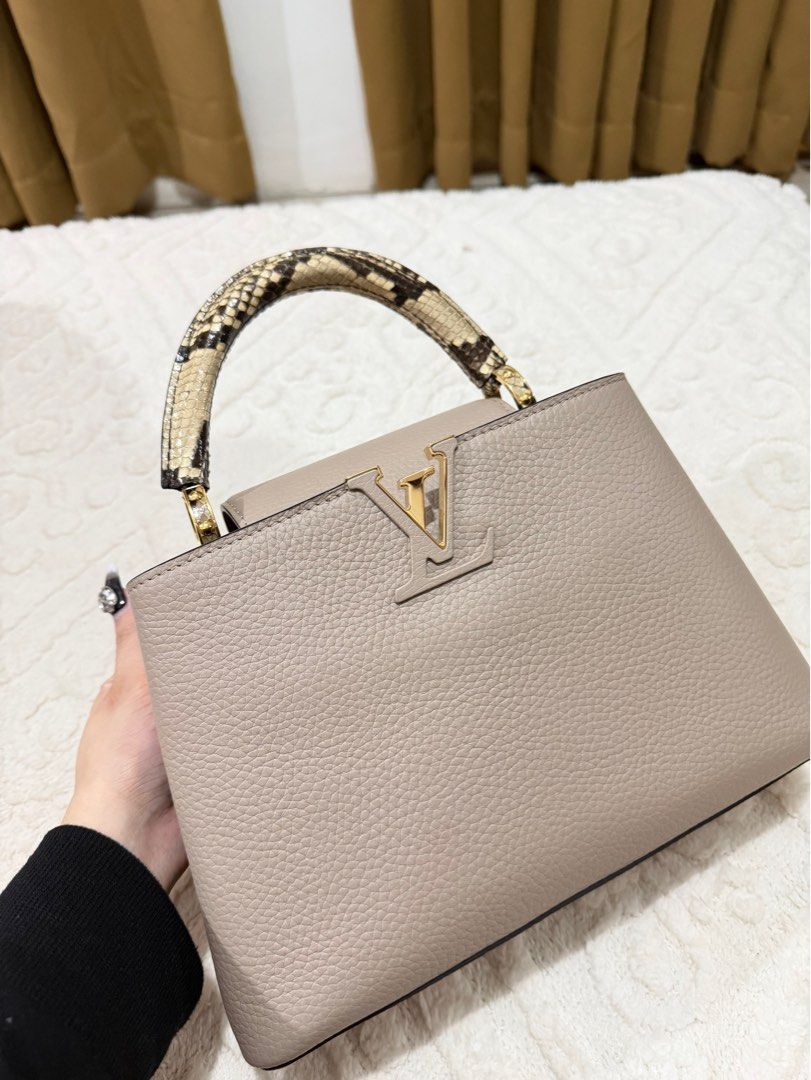 Louis Vuitton Capucines Mini Handbag (Category: Luxury Bags & Wallets) located in Manila. Submitted by luxurychicc (Listing ID 1406313708, Image 1). Description: - Authentic Louis Vuitton Capucines Mini - Neutral color - Textured leather body - Snakeskin design handle - Iconic LV logo - Perfect for any occasion Complete inclusuon with certificate from DENR.