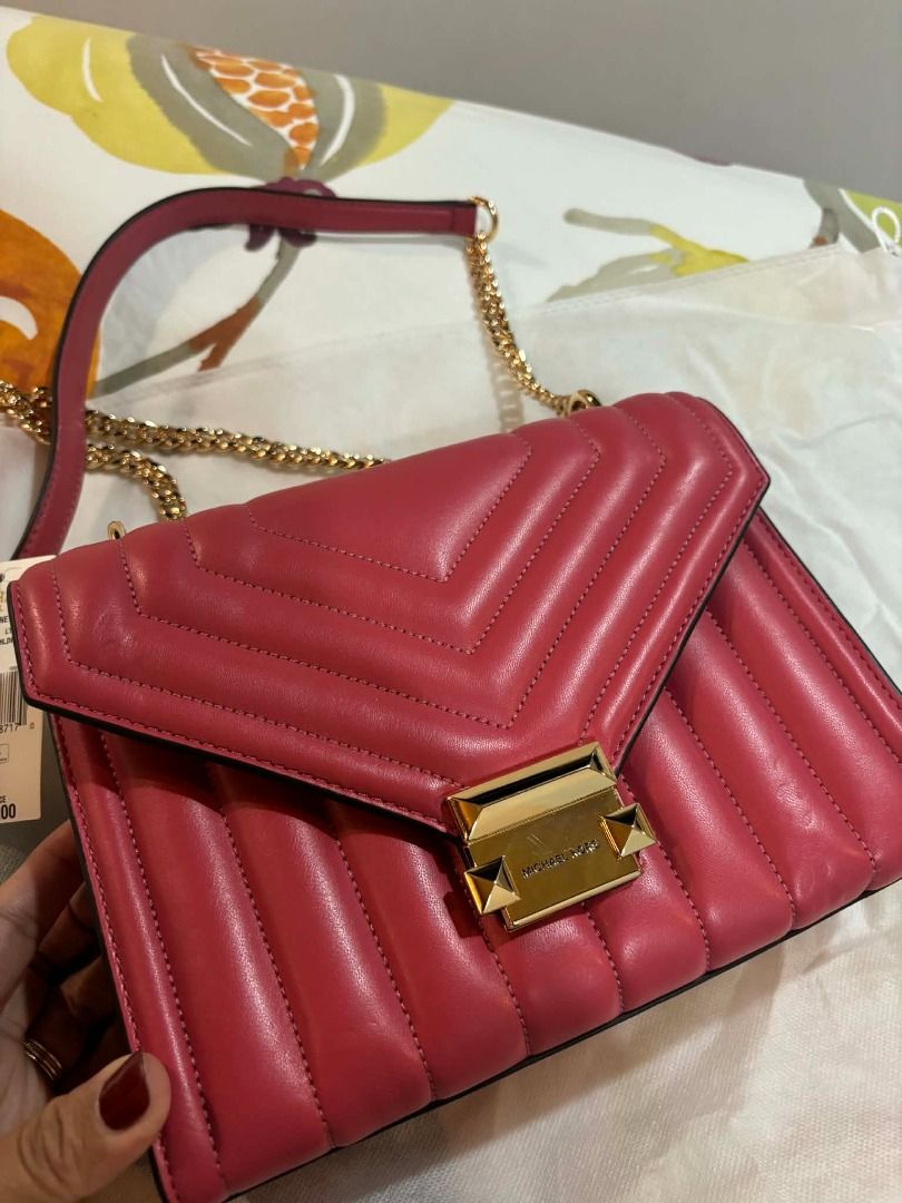Michael Kors Whitney Flap Chain Shoulder Bag (Category: Luxury Bags & Wallets) located in General Mariano Alvarez. Submitted by mihabubotz (Listing ID 1406393899, Image 2). Description: - Authentic Michael Kors Whitney shoulder bag - Stunning pink color with gold-tone hardware - Stylish chain strap - Secure flap closure - Multiple interior compartments - Includes original price tag - Comes with original dust bag.