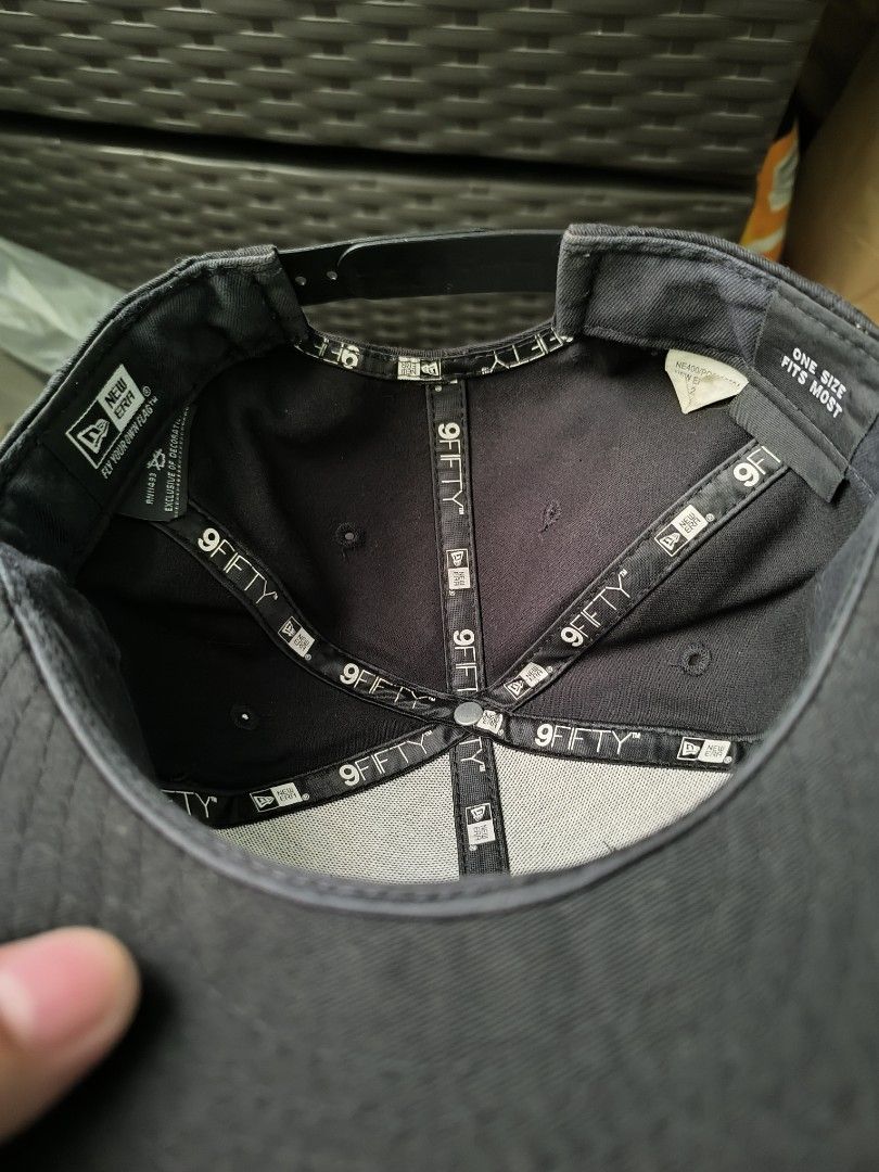 New Era Plain Cap (Category: Caps & Hats) located in Rizal. Submitted by archive_silhouette (Listing ID 1406312007, Image 3). Description: - New Era 9Fifty cap - Color: Black - Flat brim - Adjustable snapback closure - Interior branding: New Era 9Fifty - Size: One Size Fits Most -Issue: Crack snap.