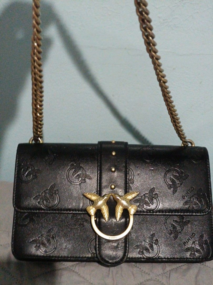 Pinko Love Bag Black (Category: Luxury Bags & Wallets) located in San Fernando. Submitted by artemisolshop_0704 (Listing ID 1406335735, Image 1). Description: - Pinko Love Bag - Black leather exterior - Gold-tone chain strap - Iconic bird buckle - Embossed bird pattern - Interior zip pocket with Pinko logo - Magnetic flap closure.