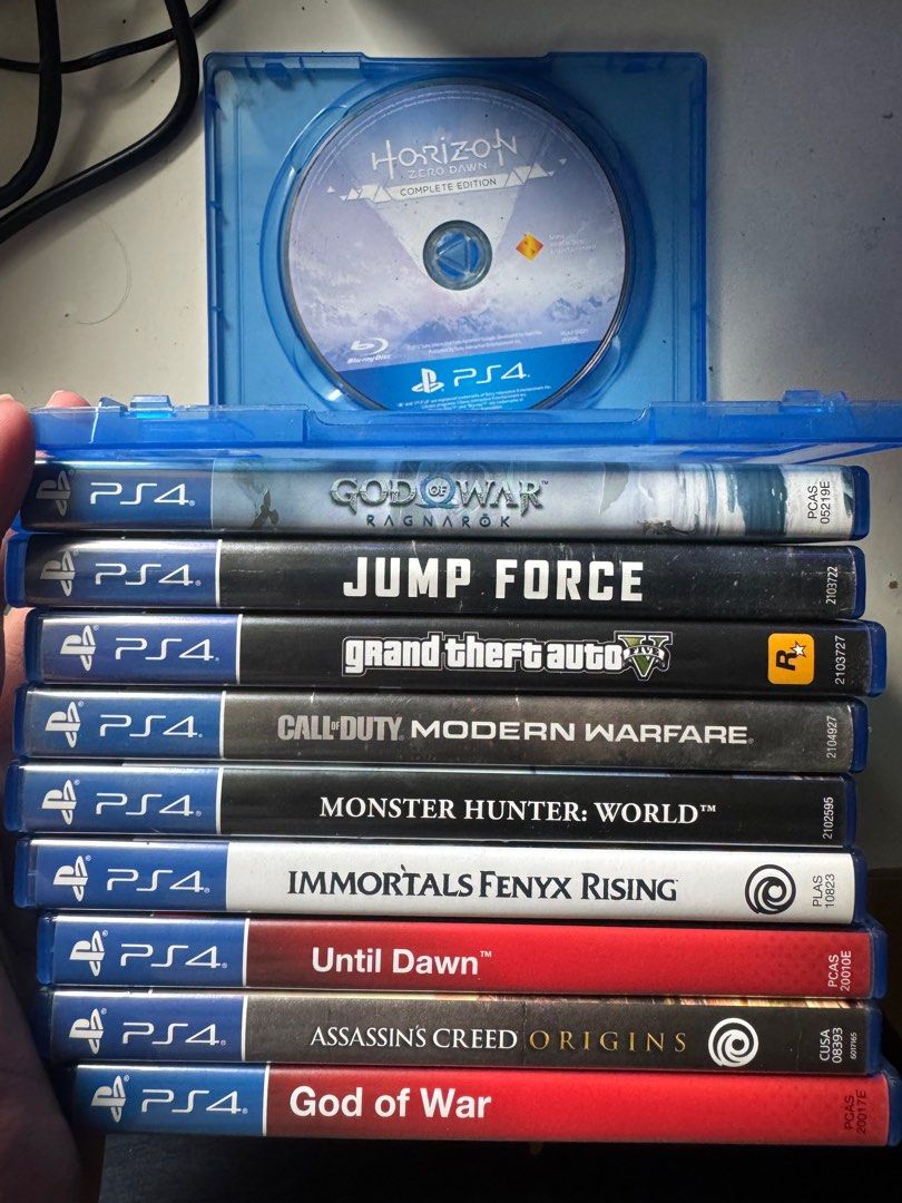 PS4 Games and DualShock Controller (Category: PlayStation) located in Pasig City. Submitted by robbiseraphin (Listing ID 1406343899, Image 1). Description: Selling: PS4 CD games & controller (items are in pasig) - Pwede din sa PS5 1. Horizon zero dawn complete edition (no cover sa case) - 400 php 2. God of War Ragnarok - 1700 php 3. Jump Force - 600 php 4. GTA 5 with map - 600 php 5. Call of duty modern warfare - 1200 6. Monster Hunter world - 50