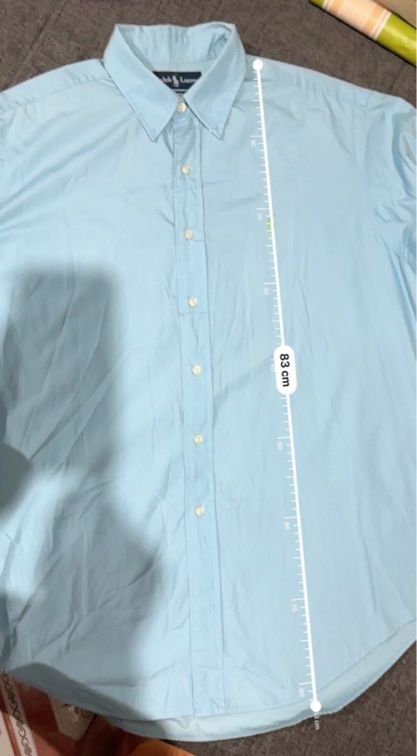 Ralph Lauren Classic Fit Light Blue Shirt (Category: Tshirts & Polo Shirts ) located in Paranaque City. Submitted by agsellsdiff (Listing ID 1406457721, Image 3). Description: FS: RL button-down 📌 Polo RL Light Blue - Size: L (fits up to XL) Length: 84cm Width: 64 cm Good condition Color may vary. May minimal & light stain sa likod (see photo for reference 🏷 ₱1,500 na lang. Negotiable! :) Parañaque Area 📥 Interested parties, DM lang..