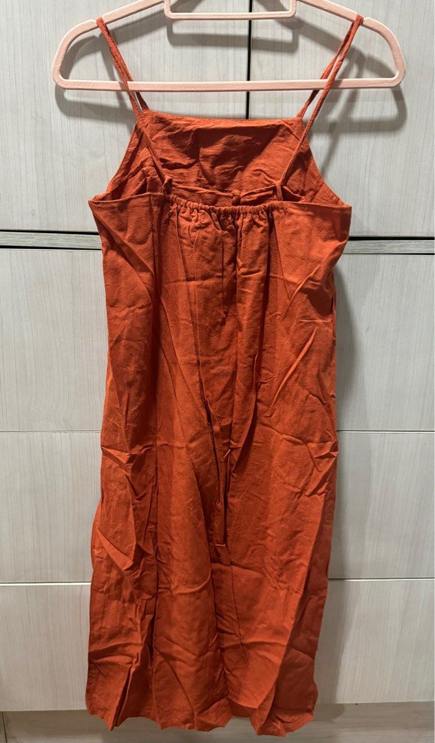 Rust / Orange Linen Midi Dress (Category: Dresses) located in Quezon City. Submitted by the_happycloset (Listing ID 1406390796, Image 2). Description: Never been used Payment methods: GCASH BDO UnionBank Shipping fee is shouldered by the buyer. Delivery options: Grab, Lalamove, J&T.