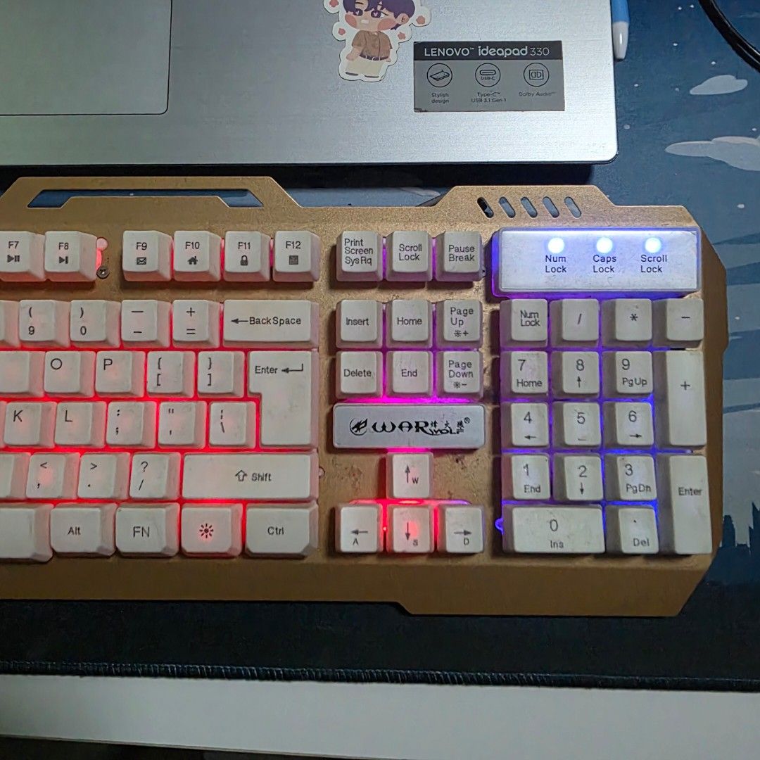 War Wolf Mechanical Feel Keyboard (Category: Computer Keyboard) located in Malabon City. Submitted by malabon.sisters (Listing ID 1406460019, Image 3). Description: - Mechanical feel keyboard - Keys are not swappable - Backlit - Numeric keypad - Unique white key and gold frame design - Wired connection - Seldom used, nastock lang. Fully functional - NEEDS CLEANING.
