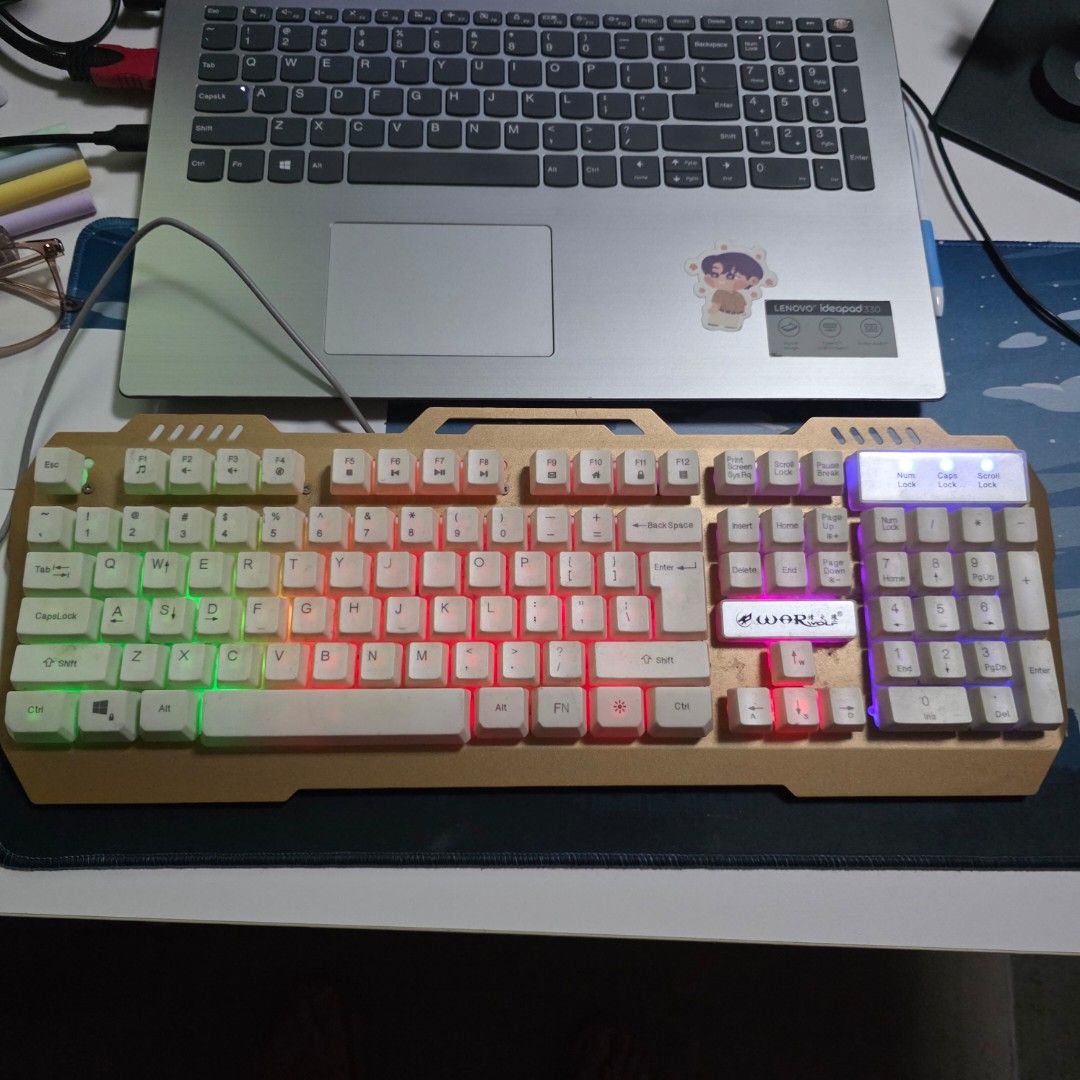 War Wolf Mechanical Feel Keyboard (Category: Computer Keyboard) located in Malabon City. Submitted by malabon.sisters (Listing ID 1406460019, Image 1). Description: - Mechanical feel keyboard - Keys are not swappable - Backlit - Numeric keypad - Unique white key and gold frame design - Wired connection - Seldom used, nastock lang. Fully functional - NEEDS CLEANING.