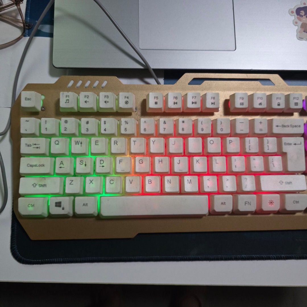 War Wolf Mechanical Feel Keyboard (Category: Computer Keyboard) located in Malabon City. Submitted by malabon.sisters (Listing ID 1406460019, Image 2). Description: - Mechanical feel keyboard - Keys are not swappable - Backlit - Numeric keypad - Unique white key and gold frame design - Wired connection - Seldom used, nastock lang. Fully functional - NEEDS CLEANING.