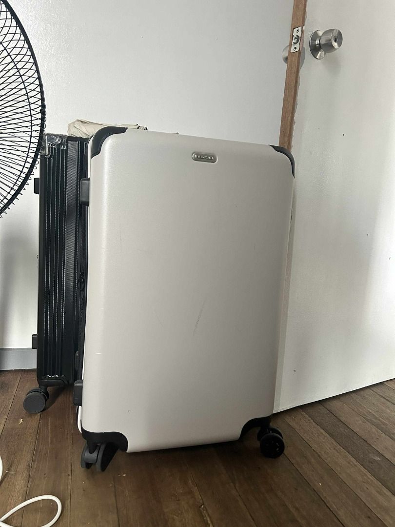 White Suitcase with TSA Lock (Category: Luggage) located in Quezon City. Submitted by jeffabe (Listing ID 1406395253, Image 1). Description: - White suitcase - TSA lock for security - Zippered closure - Convenient handle - Smooth-rolling wheels - Interior compartments and straps for organization - Used once - Body size: 70x45x29+5cm - Color: white sand - Capacity: 82-96L Cross-posted.
