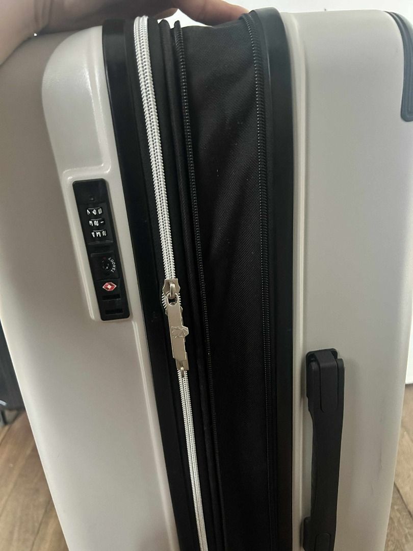 White Suitcase with TSA Lock (Category: Luggage) located in Quezon City. Submitted by jeffabe (Listing ID 1406395253, Image 2). Description: - White suitcase - TSA lock for security - Zippered closure - Convenient handle - Smooth-rolling wheels - Interior compartments and straps for organization - Used once - Body size: 70x45x29+5cm - Color: white sand - Capacity: 82-96L Cross-posted.