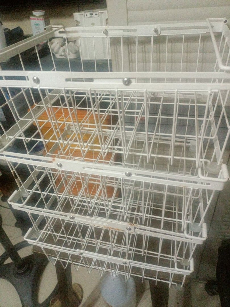 Chest Freezer White Wire Storage Basket Organizer (Category: Storage Boxes & Baskets) located in Pasig City. Submitted by margauxcouture (Listing ID 1406322623, Image 1). Description: - White wire storage basket - Multi-tiered design - Rectangular shape - Made of metal wire - Ideal for kitchen, bathroom, or other spaces - Allows easy visibility of contents.