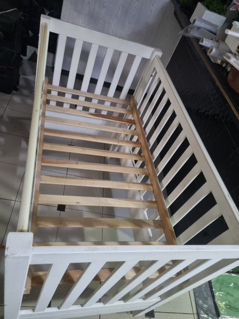 White Wooden Baby Crib (Category: Cots & Cribs) located in Imus. Submitted by naomi_29 (Listing ID 1406365866, Image 2). Description: - White wooden baby crib - Well-constructed - Ideal for baby's sleeping area - with foam .