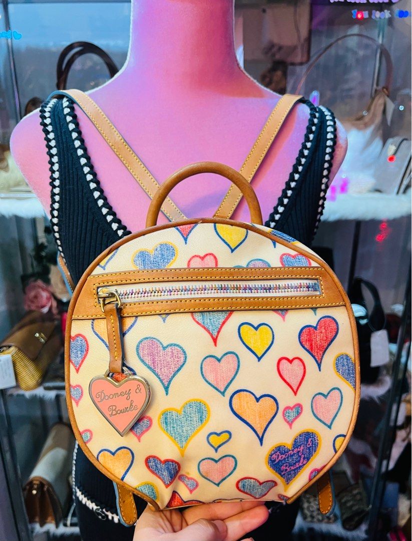 Authentic Dooney & Bourke Heart Prints Leather Backpack(Rare Piece) (Category: Luxury Bags & Wallets) located in Dumaguete. Submitted by lovebags.ph (Listing ID 1406480099, Image 1). Description: Superrrrr cute and pretty in actual! 🩵.